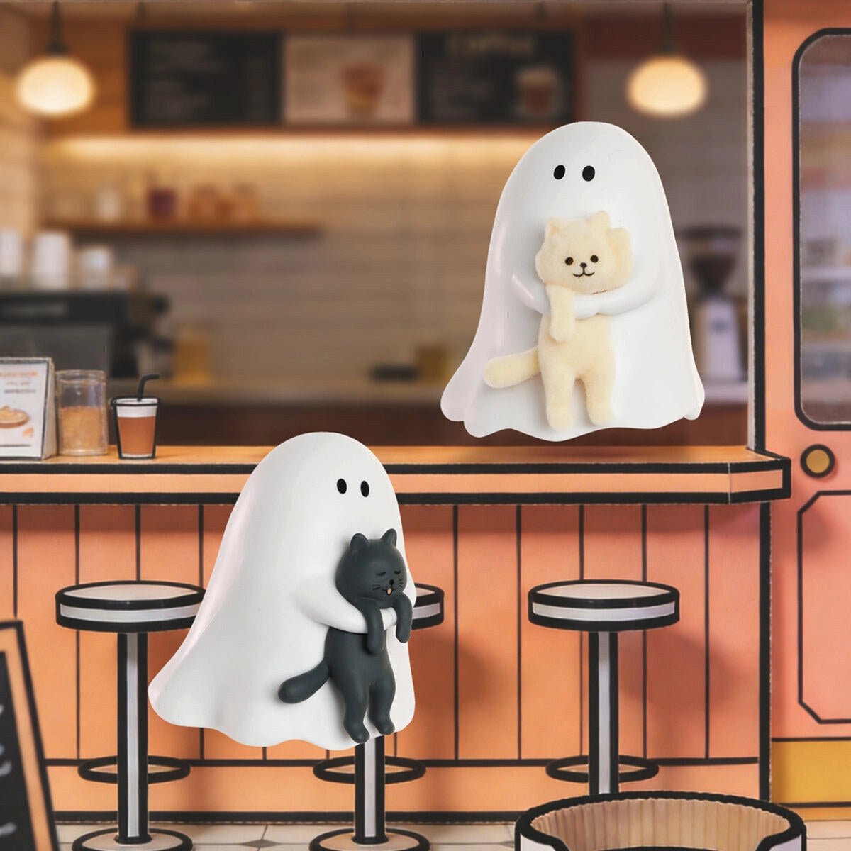 GHODY ghosts with their cats on a cafe counter, one glowing green in the dark