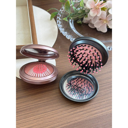 Black Hello Kitty folding comb brushing through long hair with air-cushion bristles